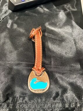 Dooney & Bourke Vintage duck hangtag.